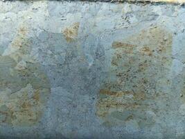 Grunge metal background and texture with scratches and cracks. Rusty metal background. Abstract background and texture for design. photo