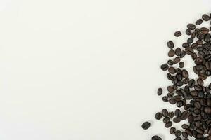 top view of coffee beans on white table photo