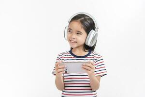 Little girl play phone mobile. Isolated on white background photo