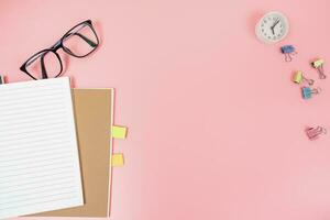 Pink office desk table Top view with copy space. Flat lay. photo