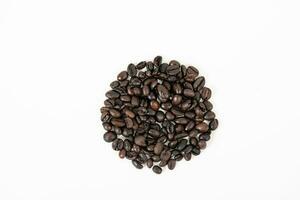 top view of coffee beans on white table photo