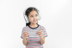 Little girl play phone mobile. Isolated on white background photo