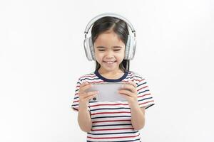 Little girl play phone mobile. Isolated on white background photo