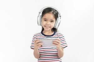 Little girl play phone mobile. Isolated on white background photo