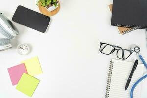 white office desk table Top view with copy space. Flat lay. photo