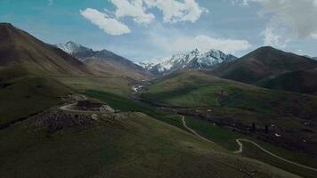 Highlands With Clouds And Snow-Capped Peaks, Aerial View video