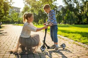 Mother and son playing in the park photo