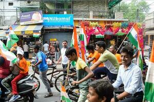 Delhi, India -15 May 2023 - Large group of people during big Tiranga Yatra organized as part of the Azadi Ka Amrit Mahotsav to celebrate the 76 anniversary of India's independence, Indian Flag march photo