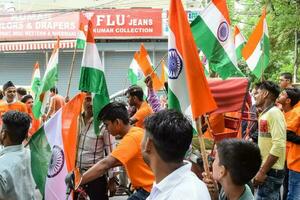 Delhi, India -15 May 2023 - Large group of people during big Tiranga Yatra organized as part of the Azadi Ka Amrit Mahotsav to celebrate the 76 anniversary of India's independence, Indian Flag march photo