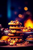 Stack of chocolate chip cookies sitting on top of table next to plate of cookies. photo