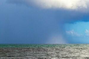 Thunderstorm strong monsoon rain huricane gloomy clouds Playa del Carmen. photo