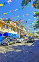 Puerto Escondido Oaxaca Mexico 2023 Typical beautiful colorful tourist street sidewalk city Puerto Escondido Mexico. photo