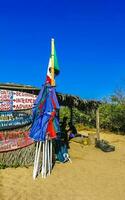 Puerto Escondido Oaxaca Mexico 2023 Sun beach sand people surfer waves palms Puerto Escondido Mexico. photo