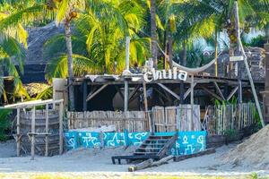 Puerto Escondido Oaxaca Mexico 2022 Sun beach sand people surfer waves palms Puerto Escondido Mexico. photo