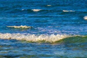 Waves at tropical beach caribbean sea clear turquoise water Mexico. photo