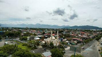 Aerial view of Mujahidin Mosque Largest Masjid in Padang, Ramadan Eid Concept background, Beautiful Landscape mosque, Islamic background Mosque, Travel and tourism. Padang, Indonesia, January 27, 2023 photo