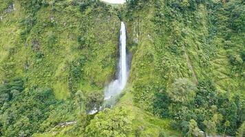 Citambur waterfall Cianjur in Indonesia. Famous tourist attractions and landmarks destination in Indonesia nature landscape. Aerial drone view of top waterfall. Cianjur, Indonesia, March 16, 2023 photo