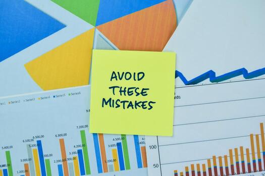 Concept of stock market and Avoid These Mistakes write on sticky notes isolated on Wooden Table. photo