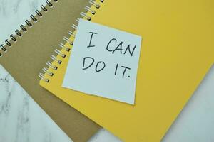 Concept of I Can Do It write on book isolated on Wooden Table. photo