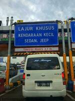 Cikampek, Indonesia in November 2022. The queue of cars that will enter the Cikampek Utama toll gate. photo