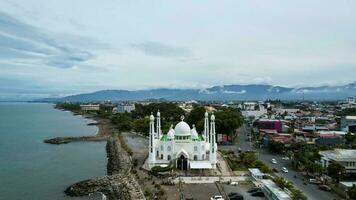 Aerial view of Al-Hakim Mosque Largest Masjid in Padang, Ramadan Eid Concept background, Beautiful Landscape mosque, Islamic background Mosque, Travel and tourism. Padang, Indonesia, January 26, 2023 photo