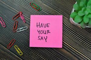 Concept of Have Your Say write on sticky notes isolated on Wooden Table. photo