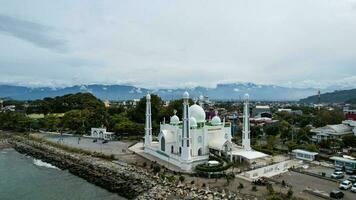 Aerial view of Al-Hakim Mosque Largest Masjid in Padang, Ramadan Eid Concept background, Beautiful Landscape mosque, Islamic background Mosque, Travel and tourism. Padang, Indonesia, January 26, 2023 photo