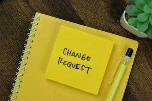 Concept of Change Request write on sticky notes isolated on Wooden Table. photo