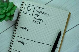 Concept of User's Persona write on book isolated on Wooden Table. photo