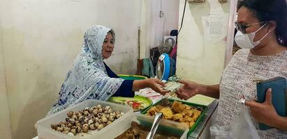 Surakarta, Central Java, Indonesia, 02 June 2023, Kadipolo Wet market Asian local people buy and sell their daily needs photo