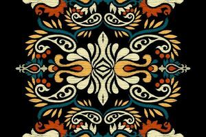 Ikat floral paisley embroidery on black background.Ikat ethnic oriental pattern traditional.Aztec style abstract vector illustration.design for texture,fabric,clothing,wrapping,decoration,scarf,carpet