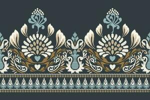 Ikat floral paisley embroidery on navy blue background.Ikat ethnic oriental pattern traditional.Aztec style abstract vector illustration.design for texture,fabric,clothing,wrapping,decoration,sarong.