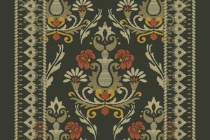 Ikat floral paisley embroidery on dark green background.Ikat ethnic oriental pattern traditional.Aztec style abstract vector illustration.design for texture,fabric,clothing,wrapping,decoration,carpet.