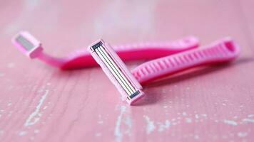 Close up of pink color razor on table video