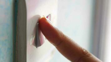 A finger turning on lighting switch video