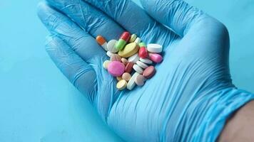 colorful medical pills and capsule on hand video