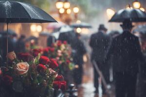 Rainy funeral. Cemetery on a rainy day with flowers and blurred background. photo