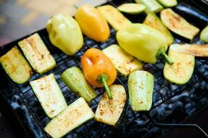 Assortment of tasty grilled vegetables over grilled coals. Barbecue party. BBQ grill photo