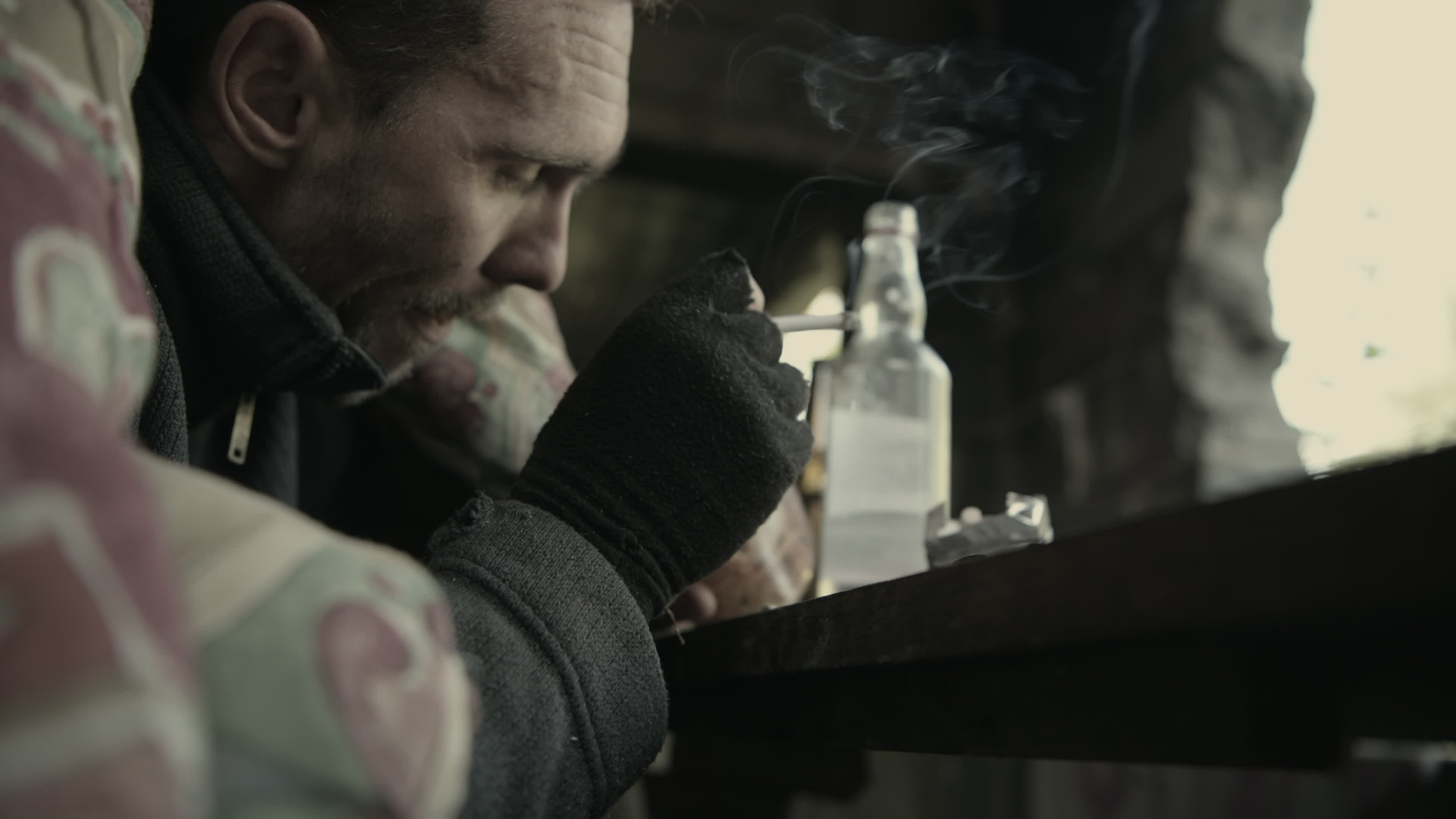Drinking Alcoholic Men Eating Some Food From a Jar and Smoking