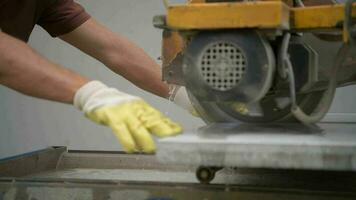 Worker Cutting Concrete Path Tiles Using Powerful Saw video