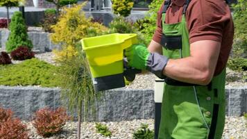 Garden Worker with Handheld Seeder video