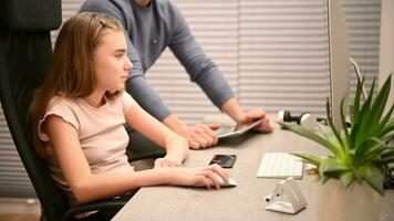 Father and His Daughter Studying Languages Using Computer video