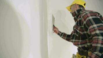 Construction Worker Patching Bathroom Ceiling video