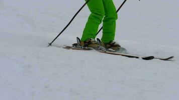 Amateur skier girl downhill, close up view video