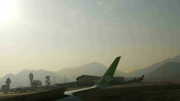 HONG KONG NOVEMBER 7, 2019 - View from taxiing S7 Airlines Airbus 320 airliner after landing in Chek Lap Kok airport video