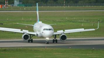 DUSSELDORF, GERMANY JULY 23, 2017 - Eurowings Airbus A320, D AEWQ taxiing the runway at Dusseldorf airport DUS video