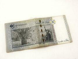 Isolated white photo of one ringgit malaysian bank notes.