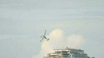 KAZAN, RUSSIAN FEDERATION, JUNE 14, 2019 - Sports plane performs extreme dangerous stunts in the air during the competition. Red Bull Air Race video