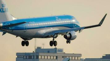 AMSTERDAM, THE NETHERLANDS JULY 25, 2017 - KLM Cityhopper Embraer ERJ 175 PH EXH flight KLM84X from Basel BSL approaching before landing at runway 06 Kaagbaan video