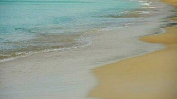 Waves rolled on the sand of Mai Khao Beach, Phuket, Thailand. Slow motion video